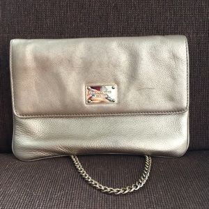Michael Kors gold shoulder bag and clutch